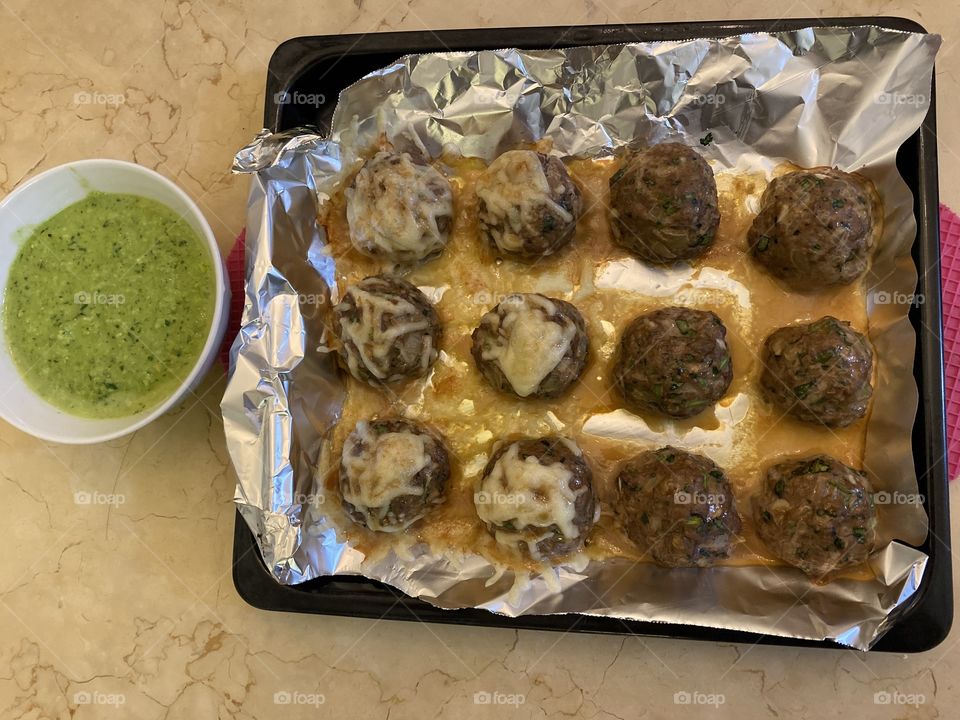 Beef balls served with pesto dip