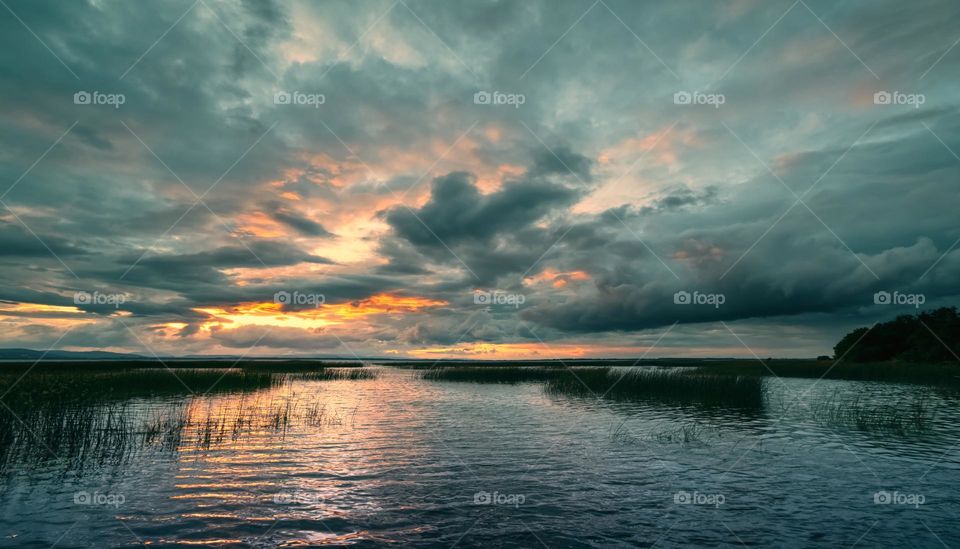 Dramatic cloudy skies over Corrib lake in Galway, Ireland