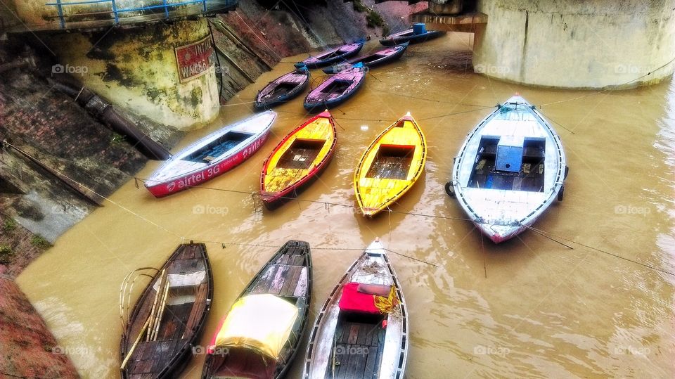 Color cocktail of floating devises on the fast flowing Ganga during monsoon...