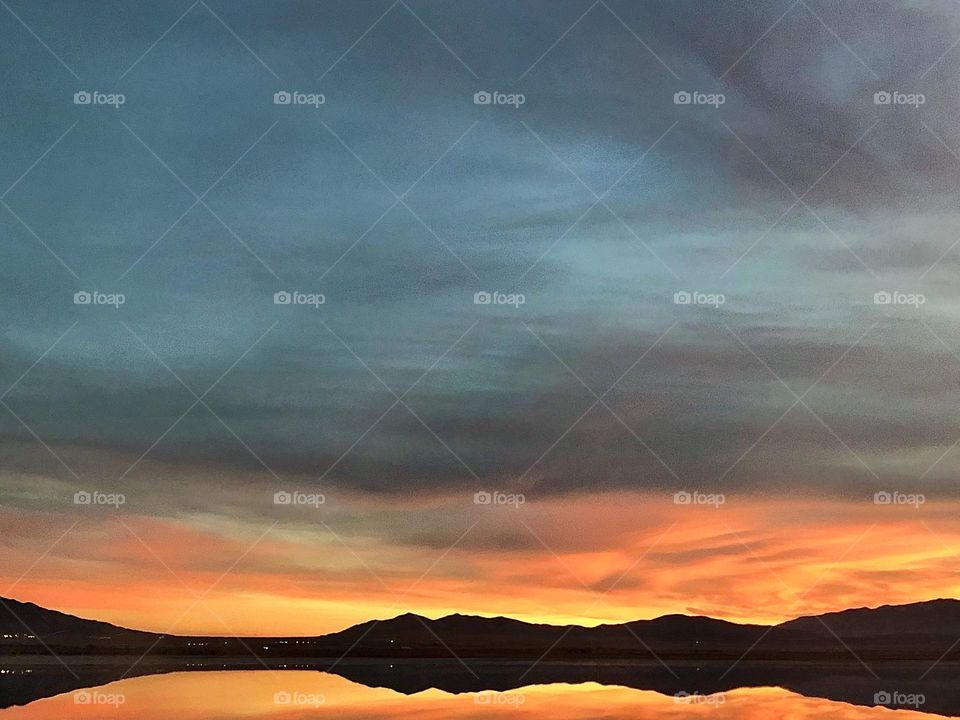 Vivid sunset reflecting on the diminishing waters of the Great Salt Lake 