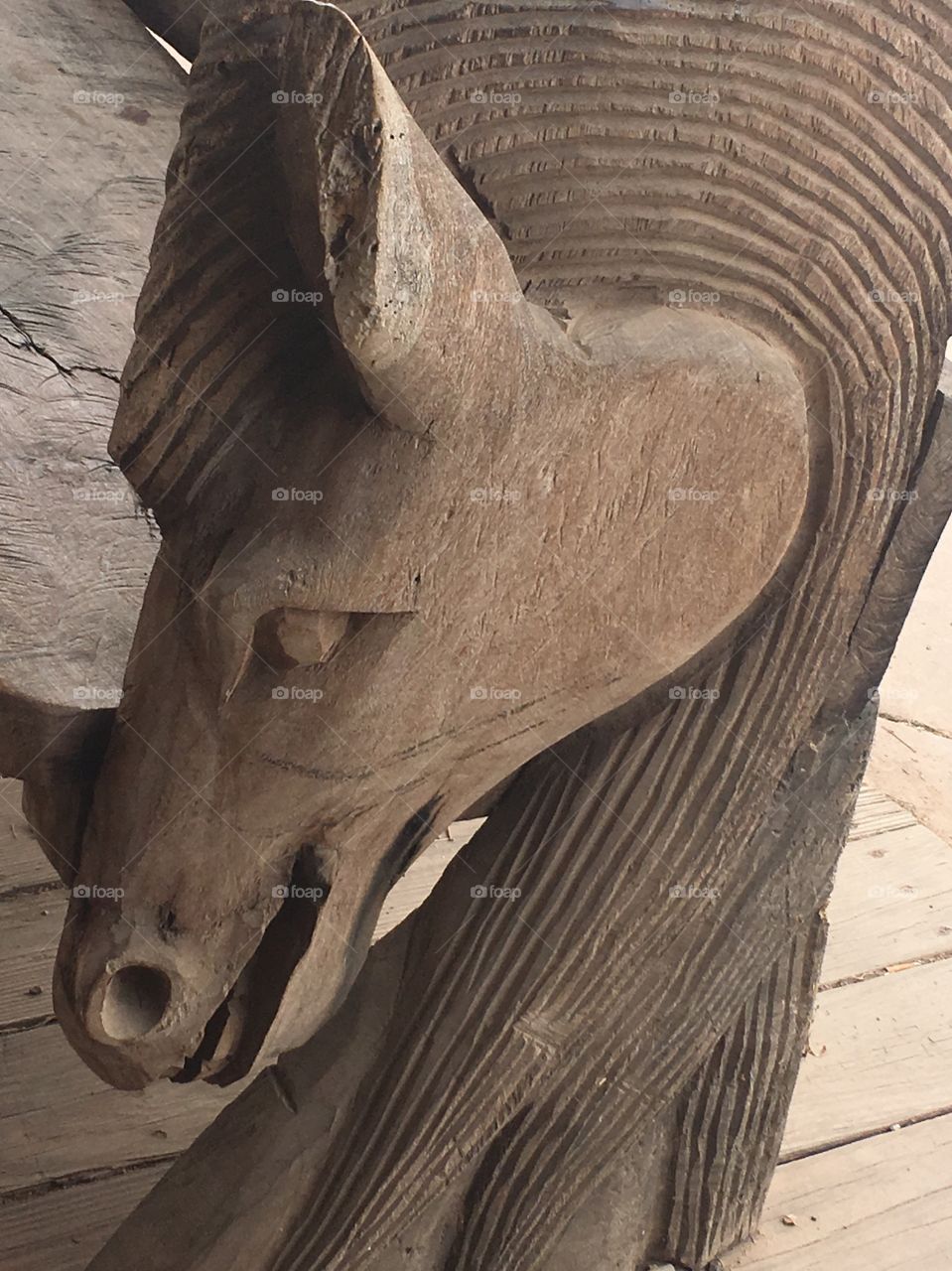 Handcrafted wooden bench horse carving—Tombstone AZ