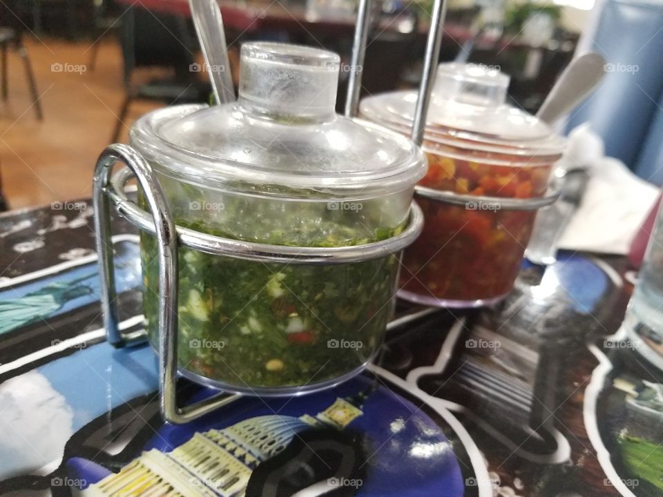 Green and red Chimichurri, an Argentine  traditional relish.