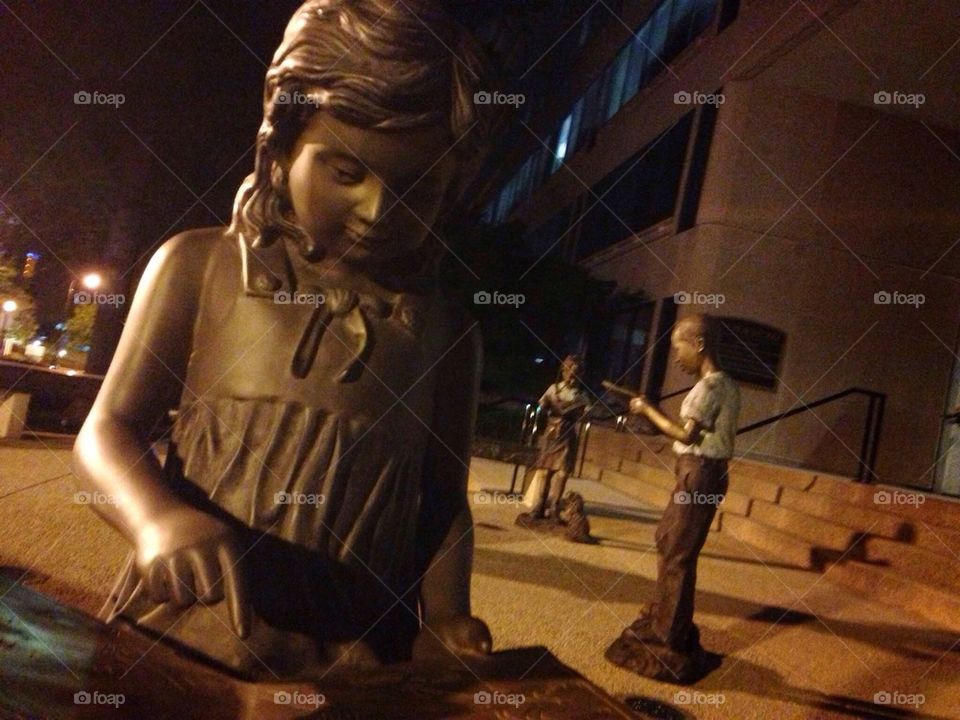 Children statues at night in Midtown Atlanta Georgia