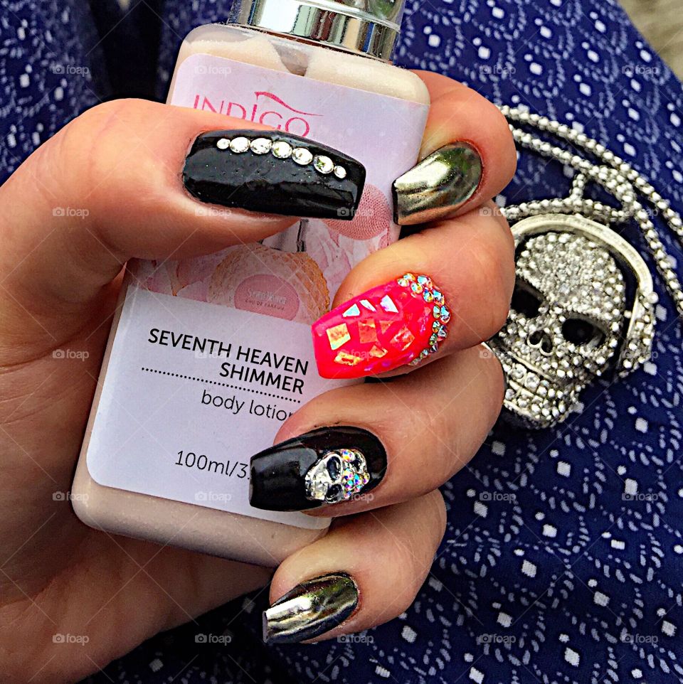 Black and Red nail polish with detailed embellishments of jewels and skull! 