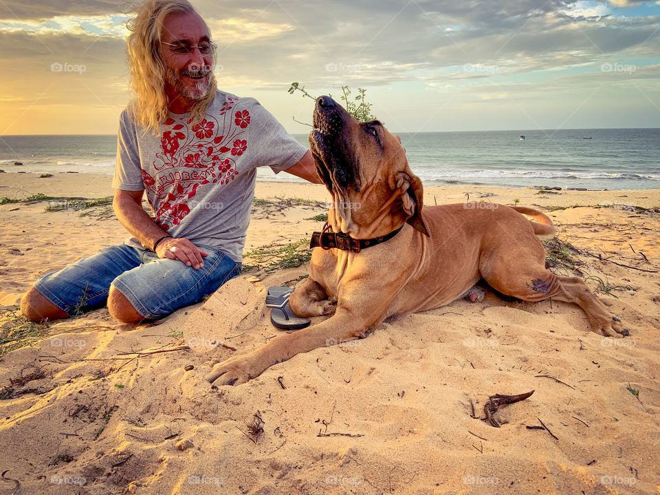 Man with dog in the beach. Brazil 