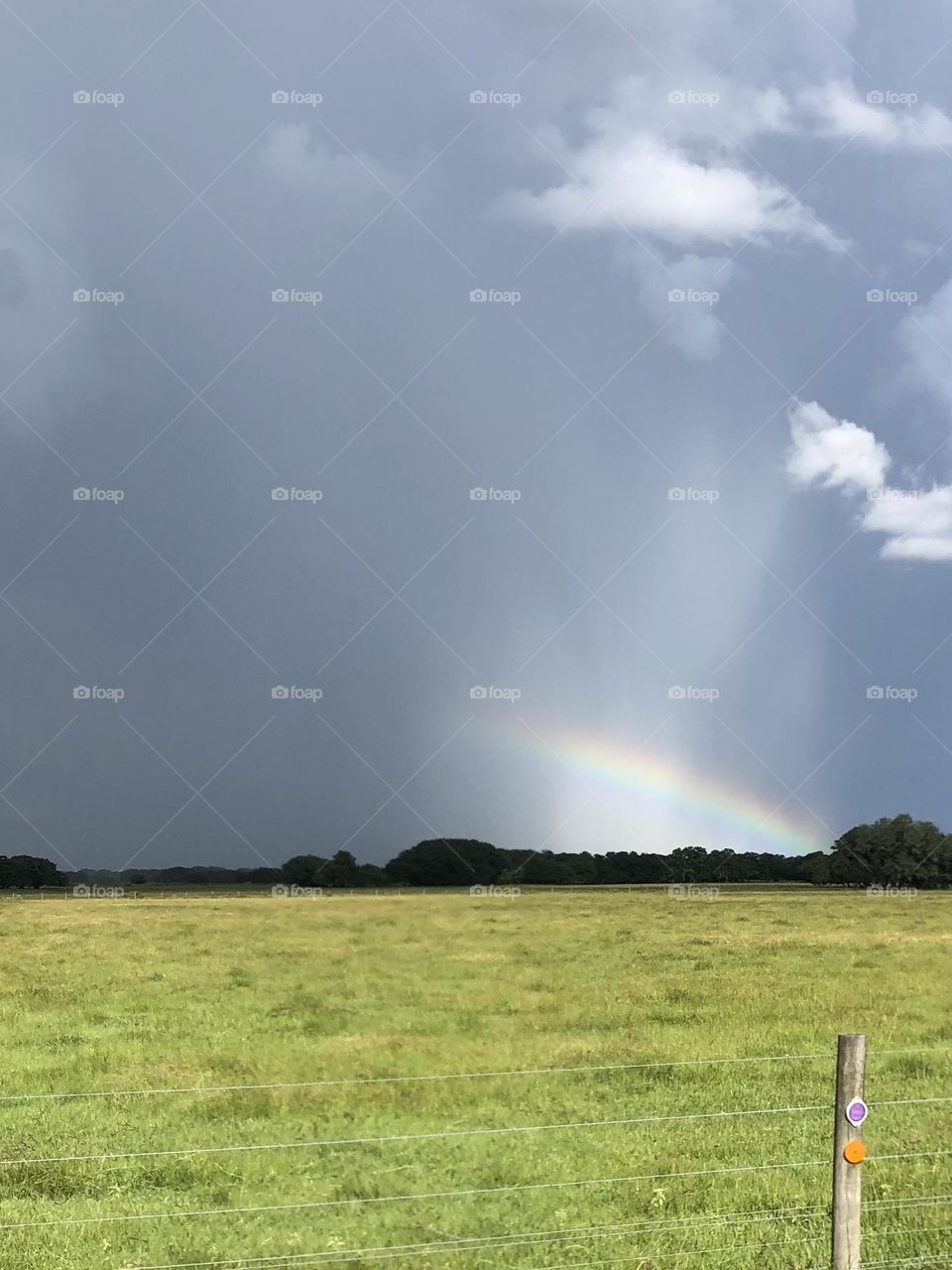 Texas sunset. Storm to the west coming in with an amazing rainbow to set it off!