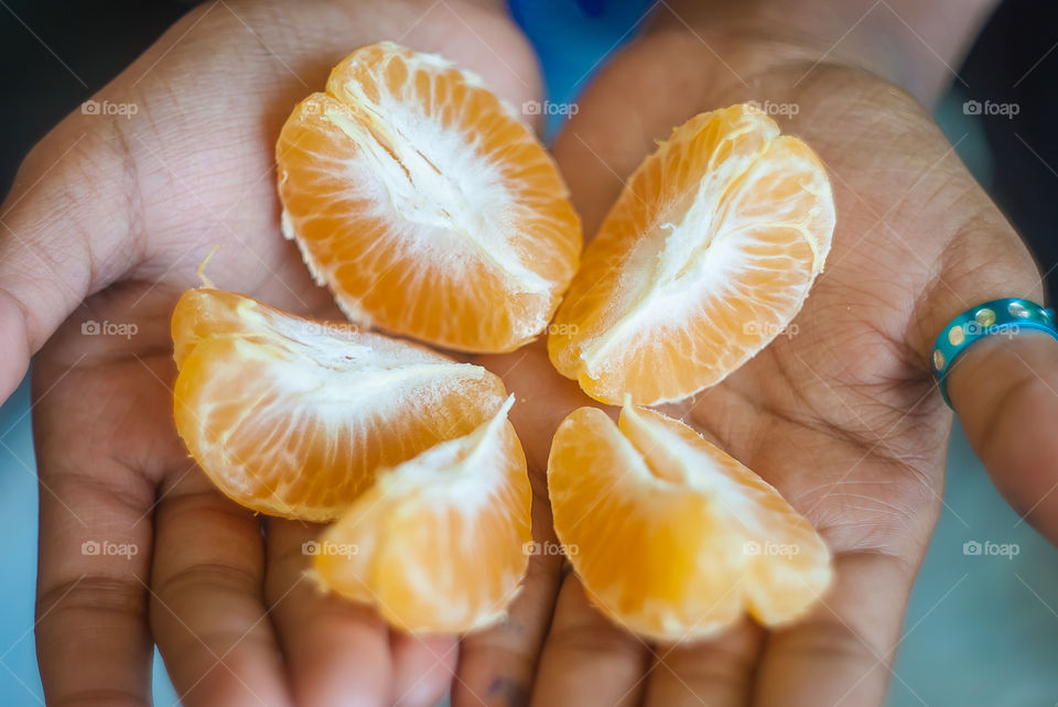 Orange slice on hand