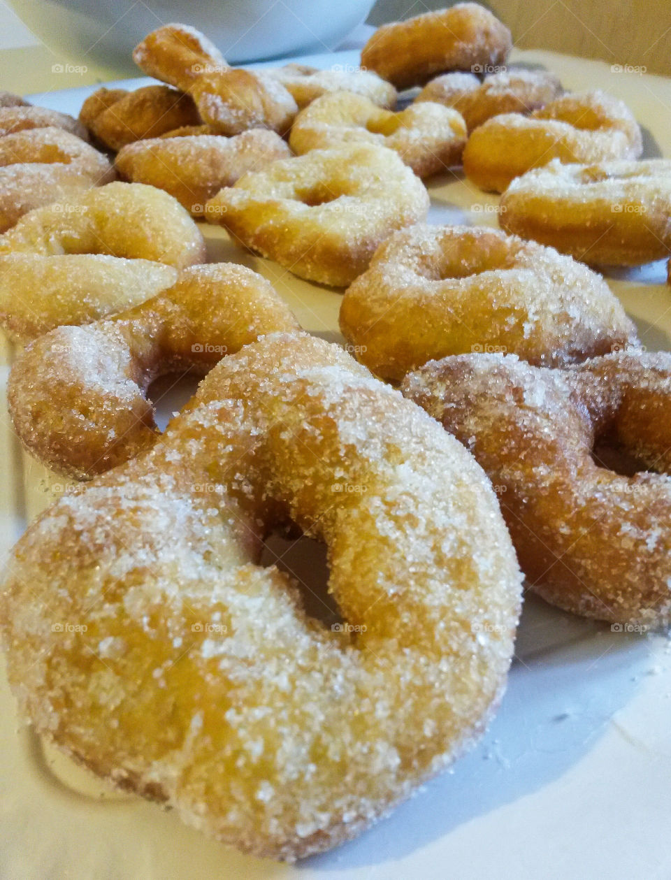 Close up of traditional italian carnival sweet named "fatti fritti", similar To donut but fried and covered of sugar