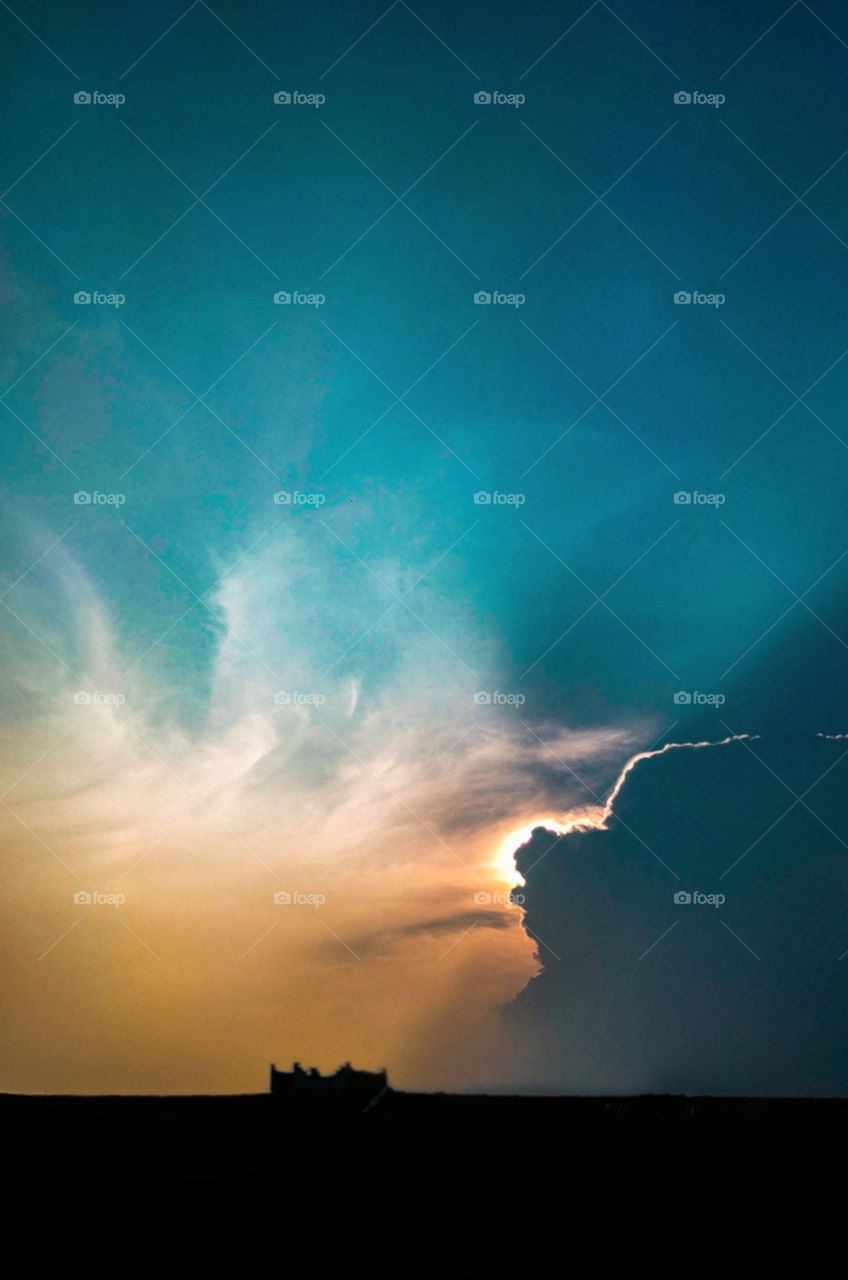 sun coming out from behind the clouds.