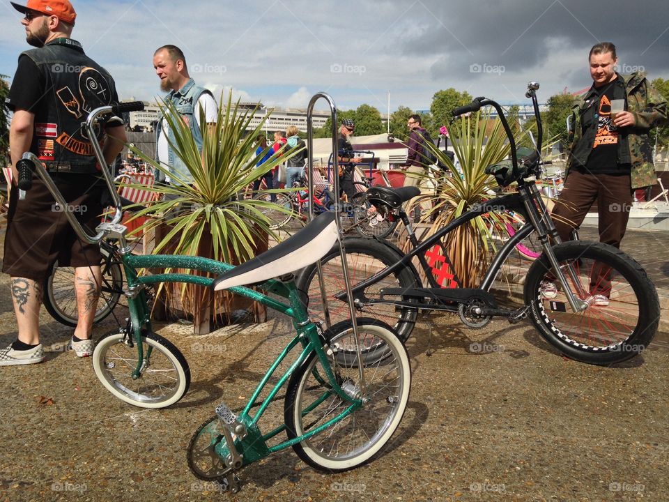 Men standing near bicycle