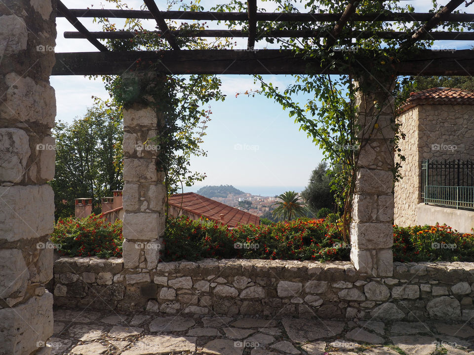 View of city of Nice from the stone pergola in the monastery gardens in Cimiez, France.