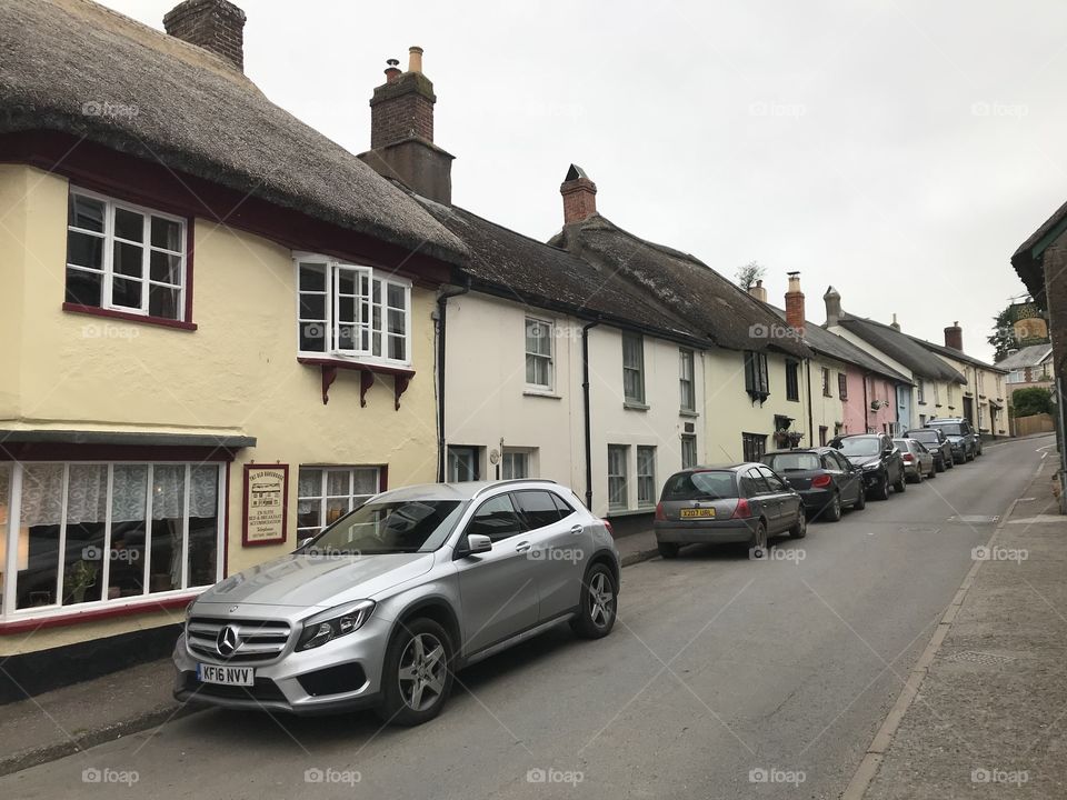 A large row of chocolate box delight, every Property has a unique likeness, all of these houses are thatched ones.