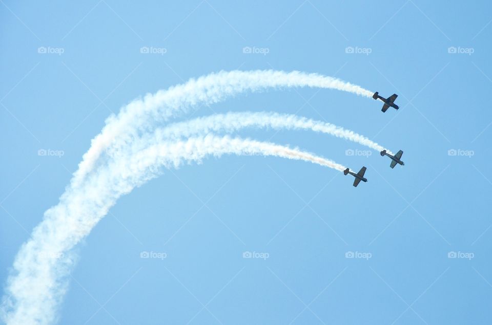 Three airplanes flying at air show