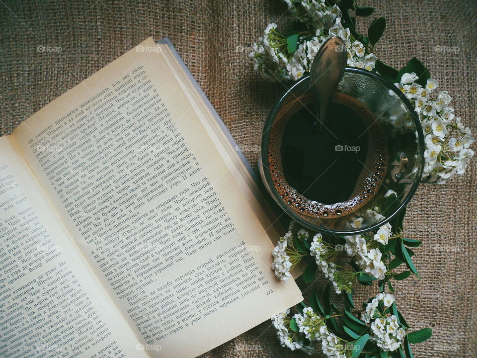 Coffee, flowers and a favorite book