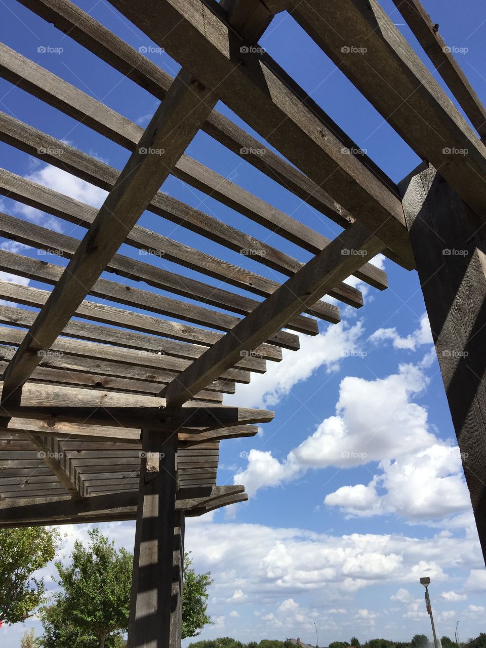 Under the pergola. Vibrant sky and clouds seen when looking up under the pergola at Abilene Christian University 