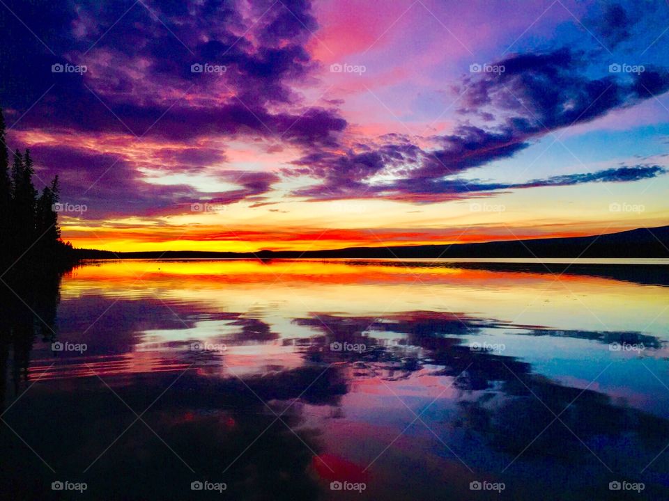 Purple sunsets are of the utmost rarity in color. A picture perfect symmetry to lake and sky reflects the beauty that was painted before me. 