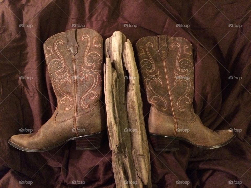 Cowboy boots & driftwood