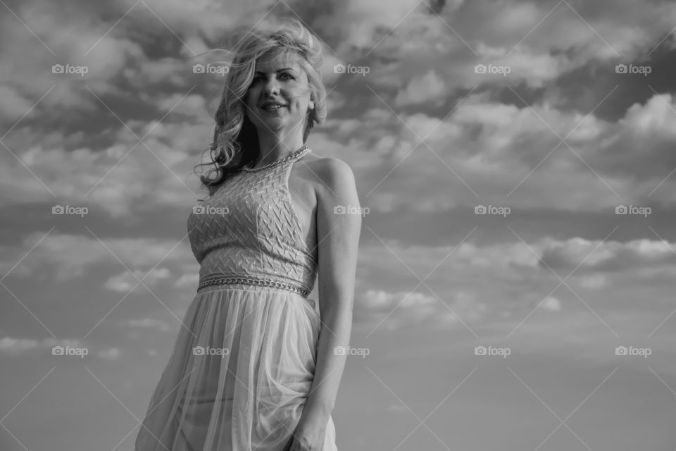 beautiful woman in wind. beautiful woman posing while wind blowing,monochrome effect