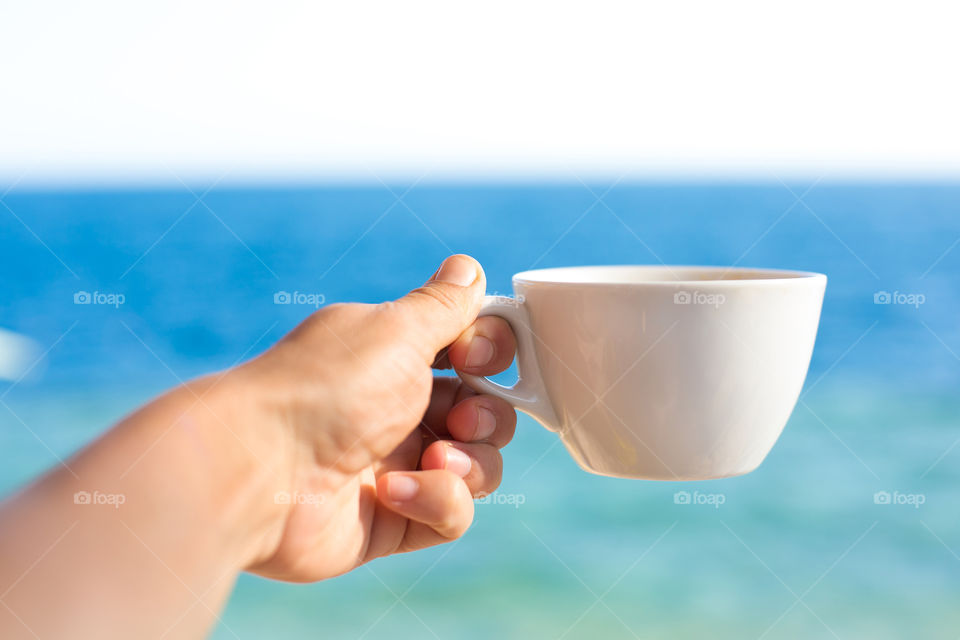 Tasty coffee near the sea