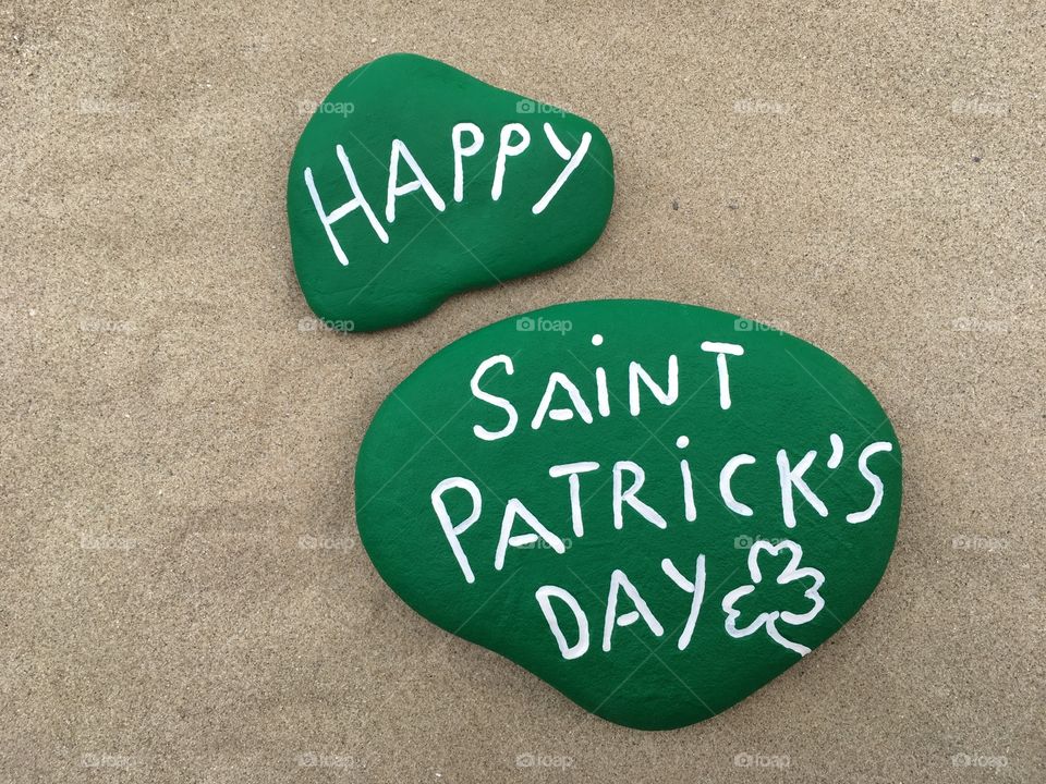 Happy Saint Patrick's Day on green painted stones