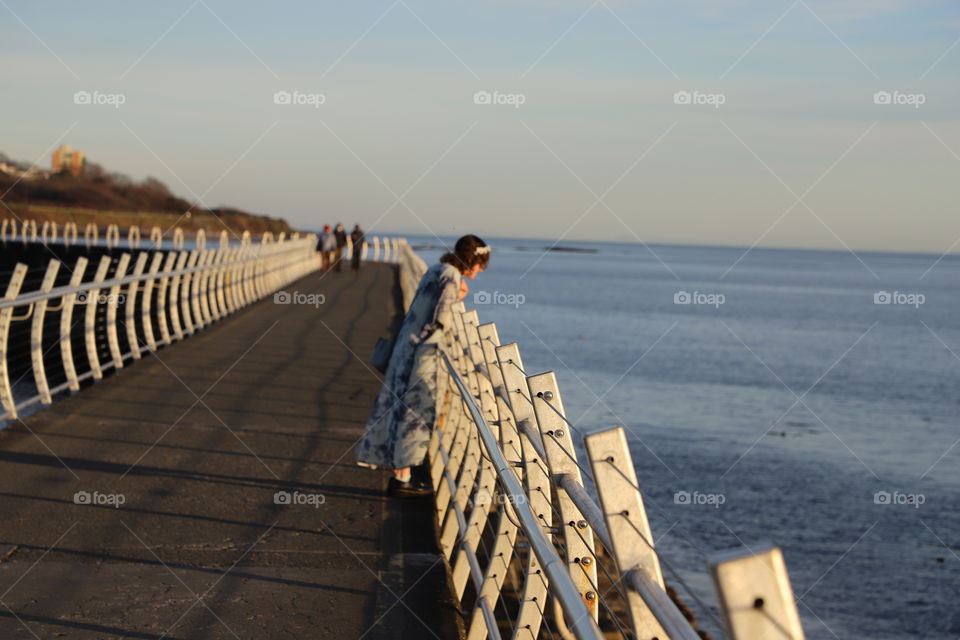 Woman on the breakwater 