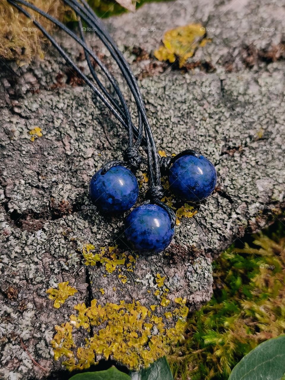 Blue lapis lazuli natural stone beads close up, gemstone chockers, jewelry