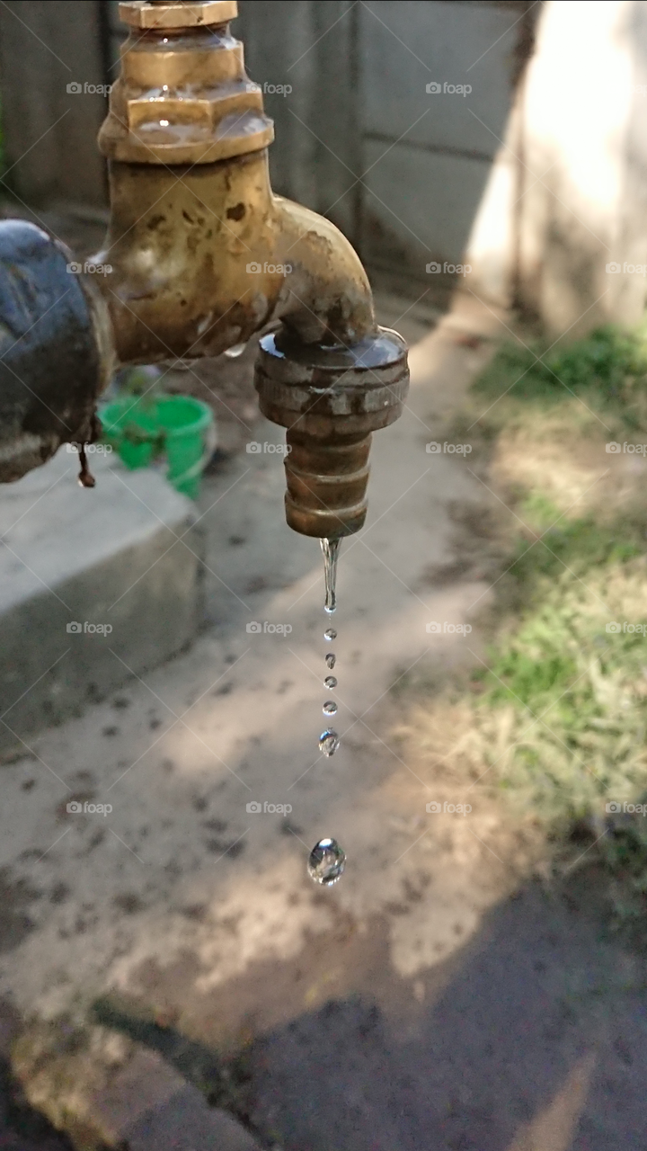 Water drops from tap