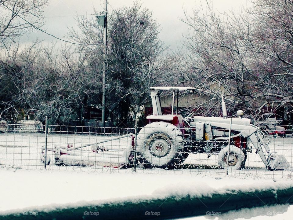 Snow covered tractor. 