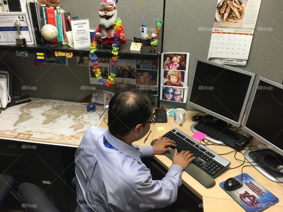 computer developer at his desk from back 