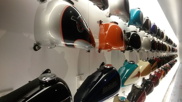Tanked. Motorcycle gas tanks on display at the Milwaukee Harley Davidson Museum. 