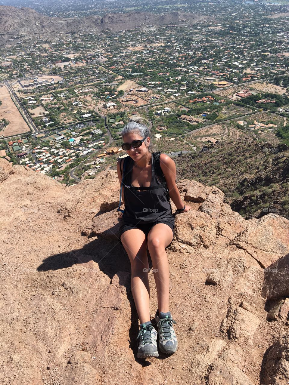 Female hiker on top of Camelback Mountain.