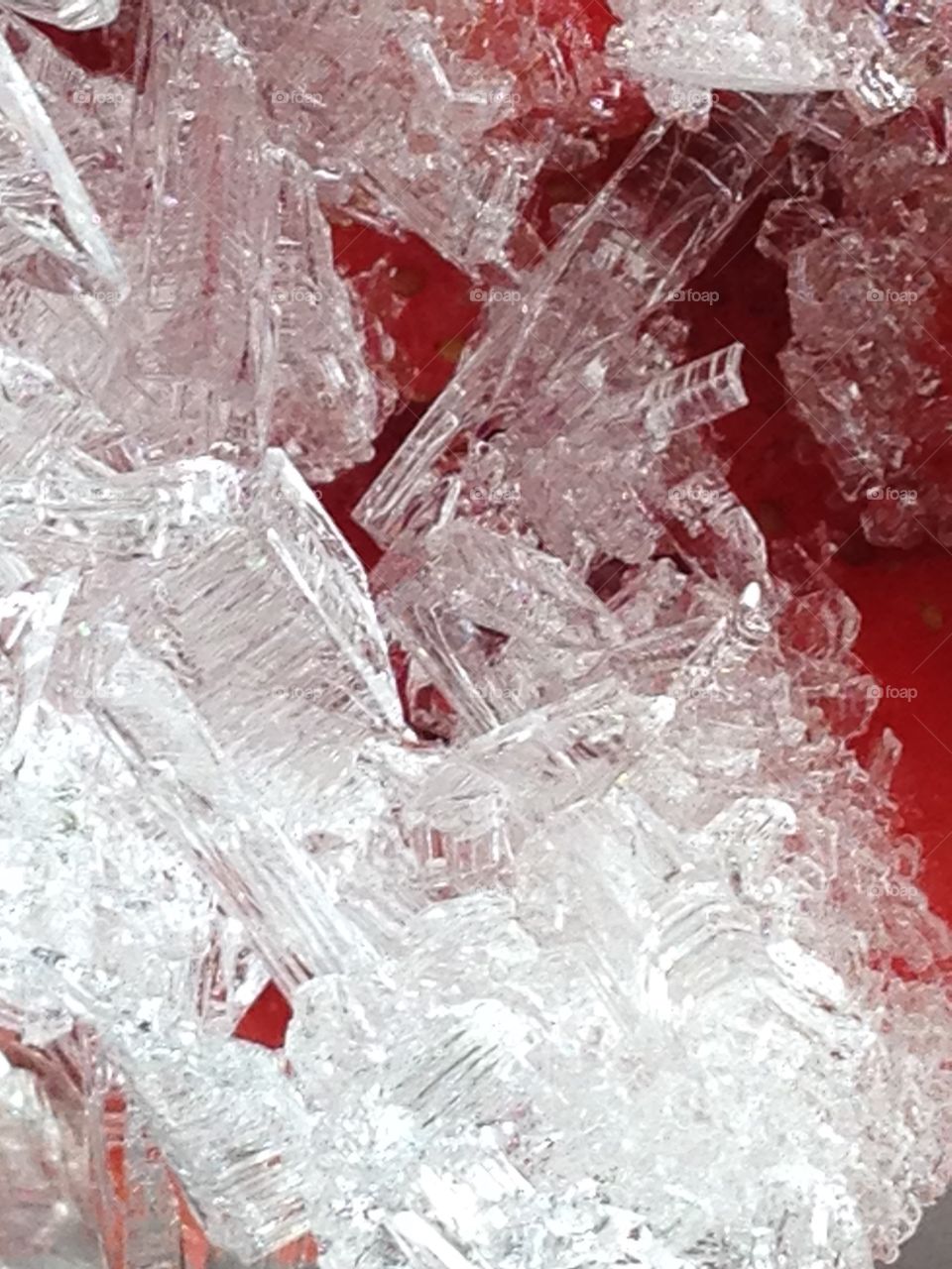 Ice crystals on top of frozen strawberries