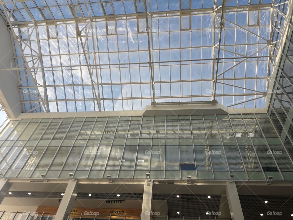 blue sky through glass ceiling