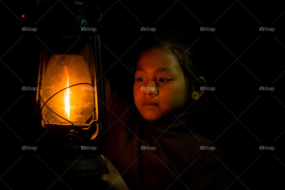 A girl with a latern light