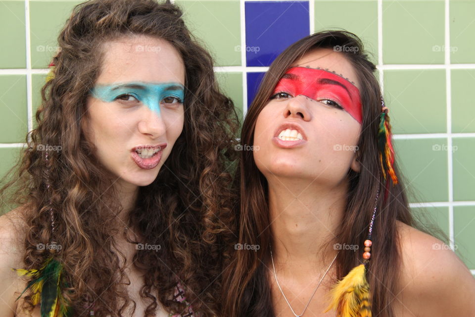 Close-up of two women with face paint