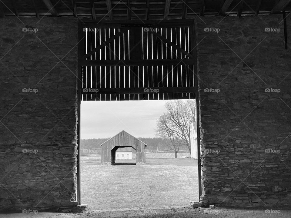 A view of a barn from inside a barn
