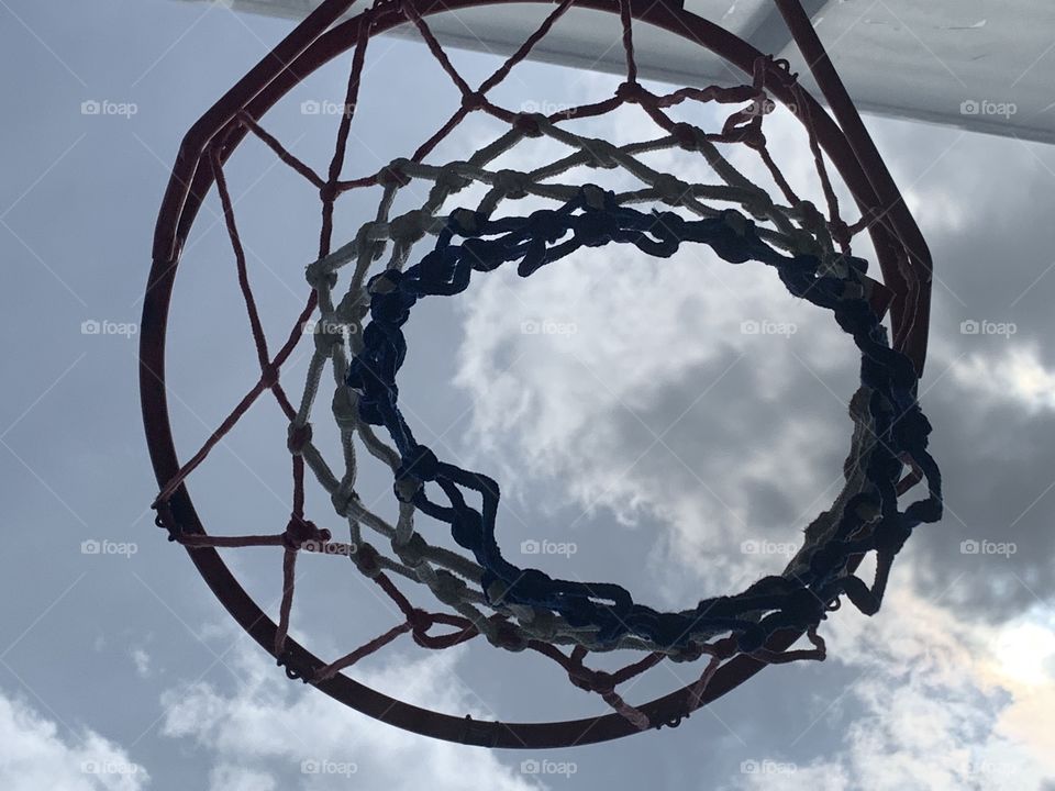 Basketball net and clouds