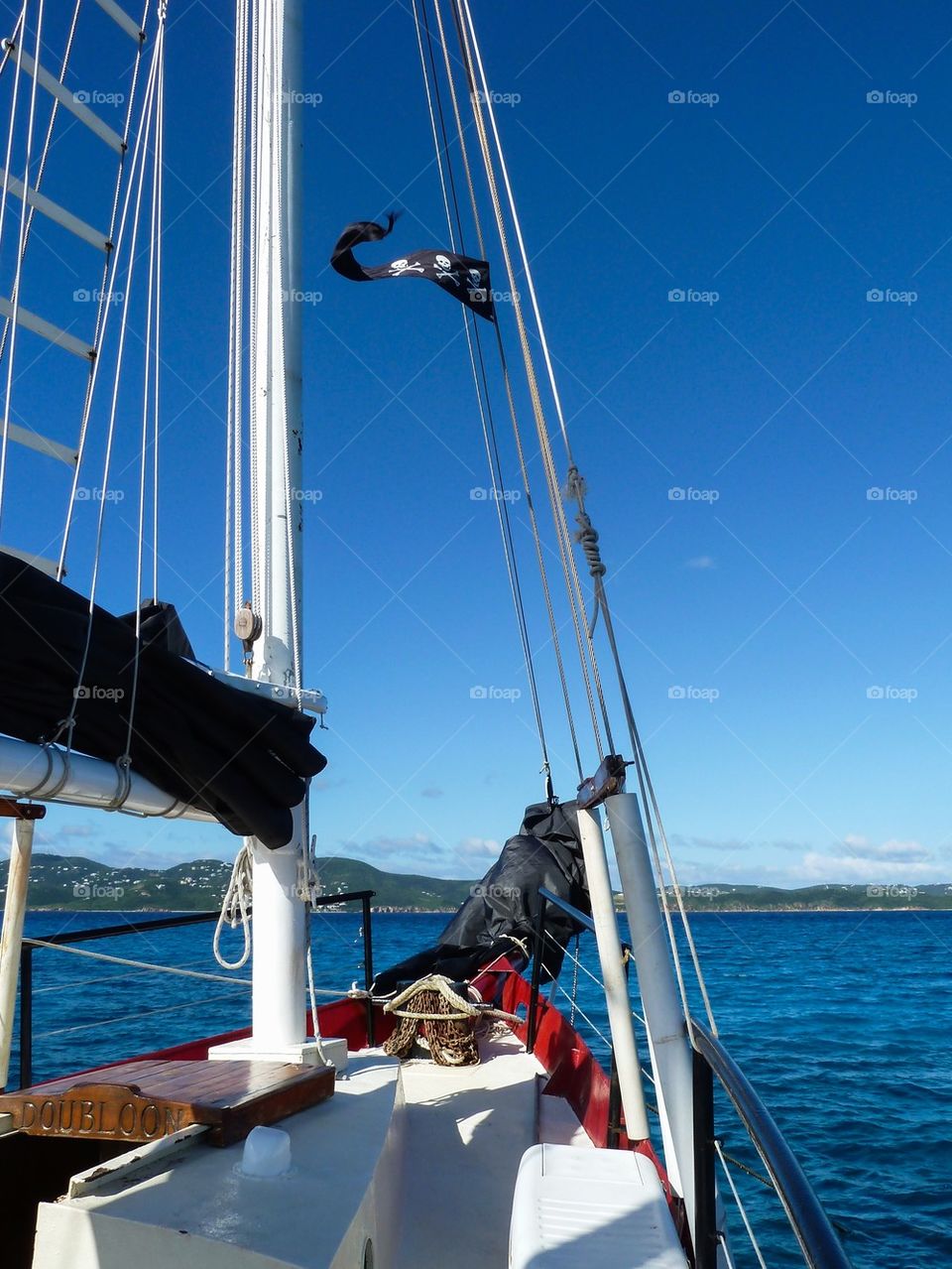 Sailing with pirate flag Caribbean