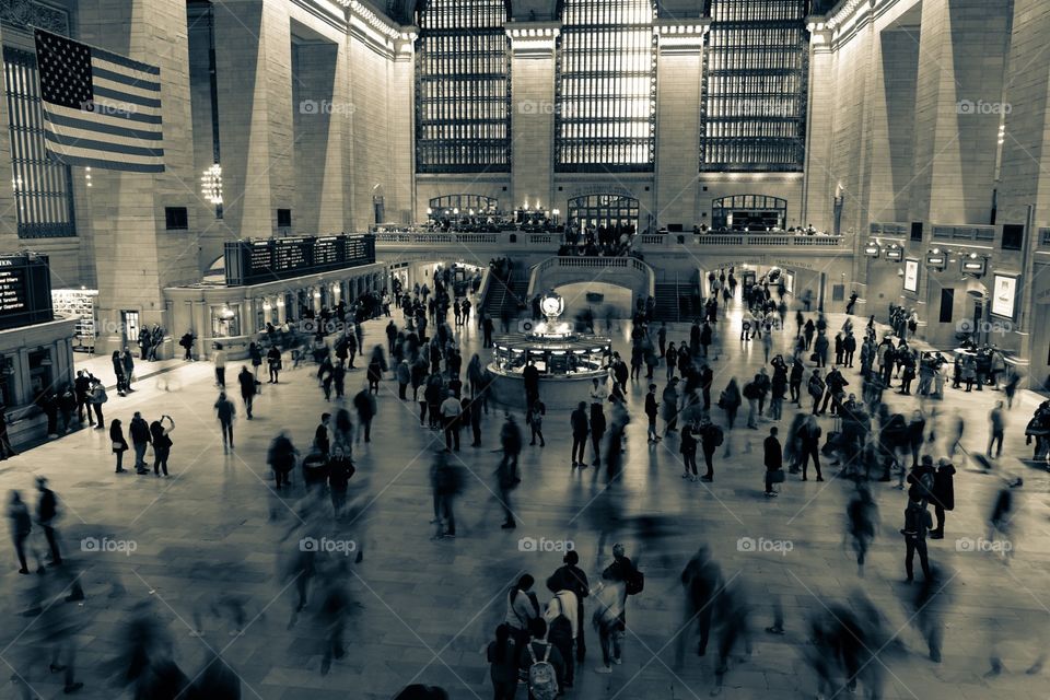 People traveling through Grand Central Station, Movement within a train station, people in New York, travels through New York, people moving, work commute, rush hour traffic, blurred motion, blurred movement by individuals