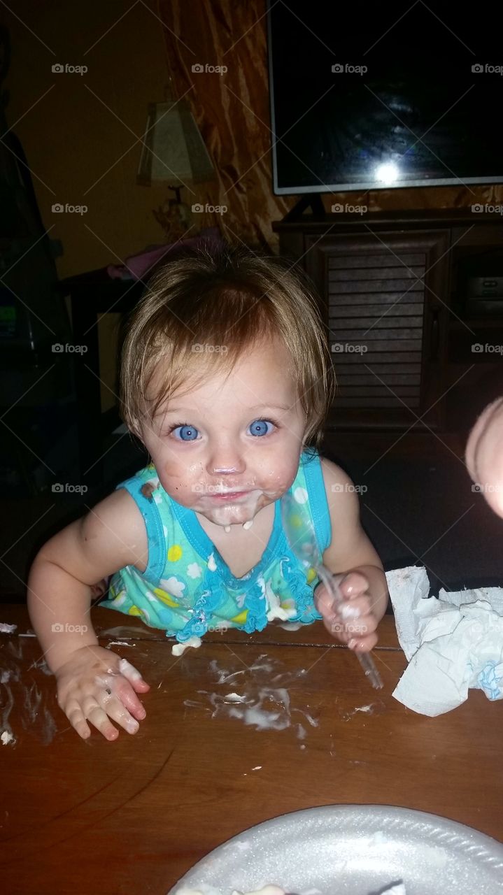 Small baby eating ice cream