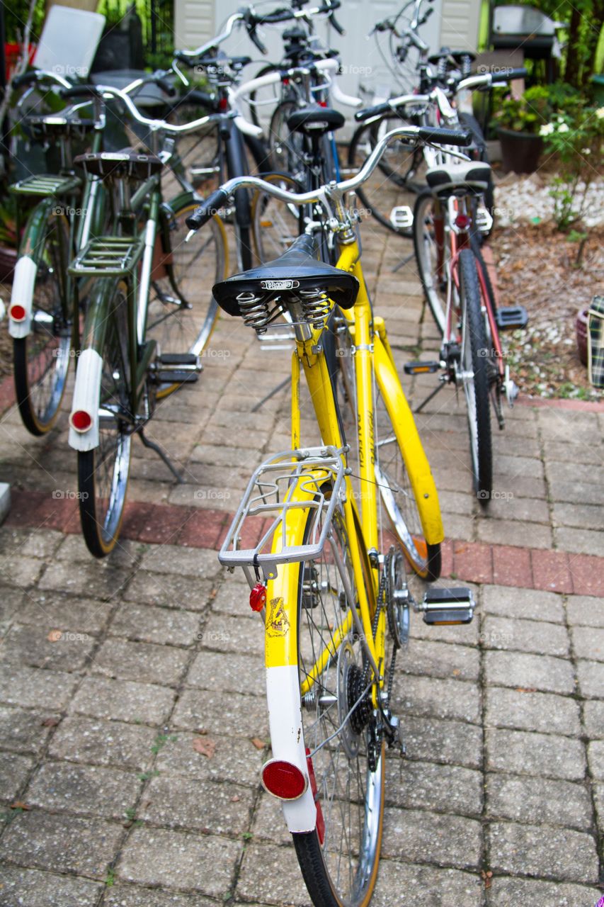 Yellow bike amongst bikes