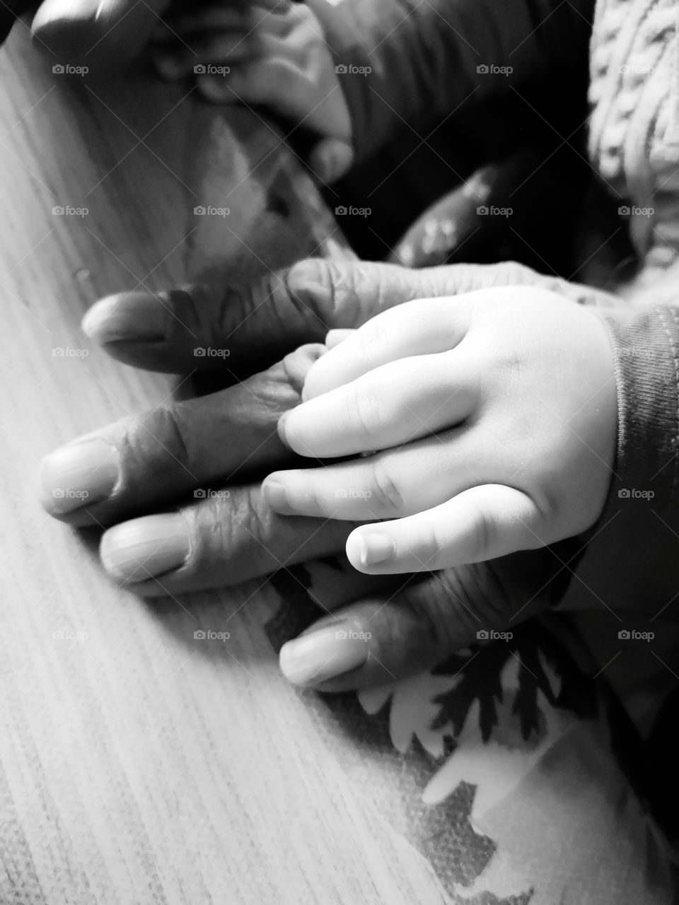 Granddaughter's Hand with Grandfathers. There are 68 years between them.