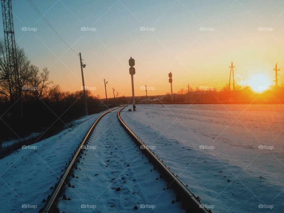 Winter sunset in railway 