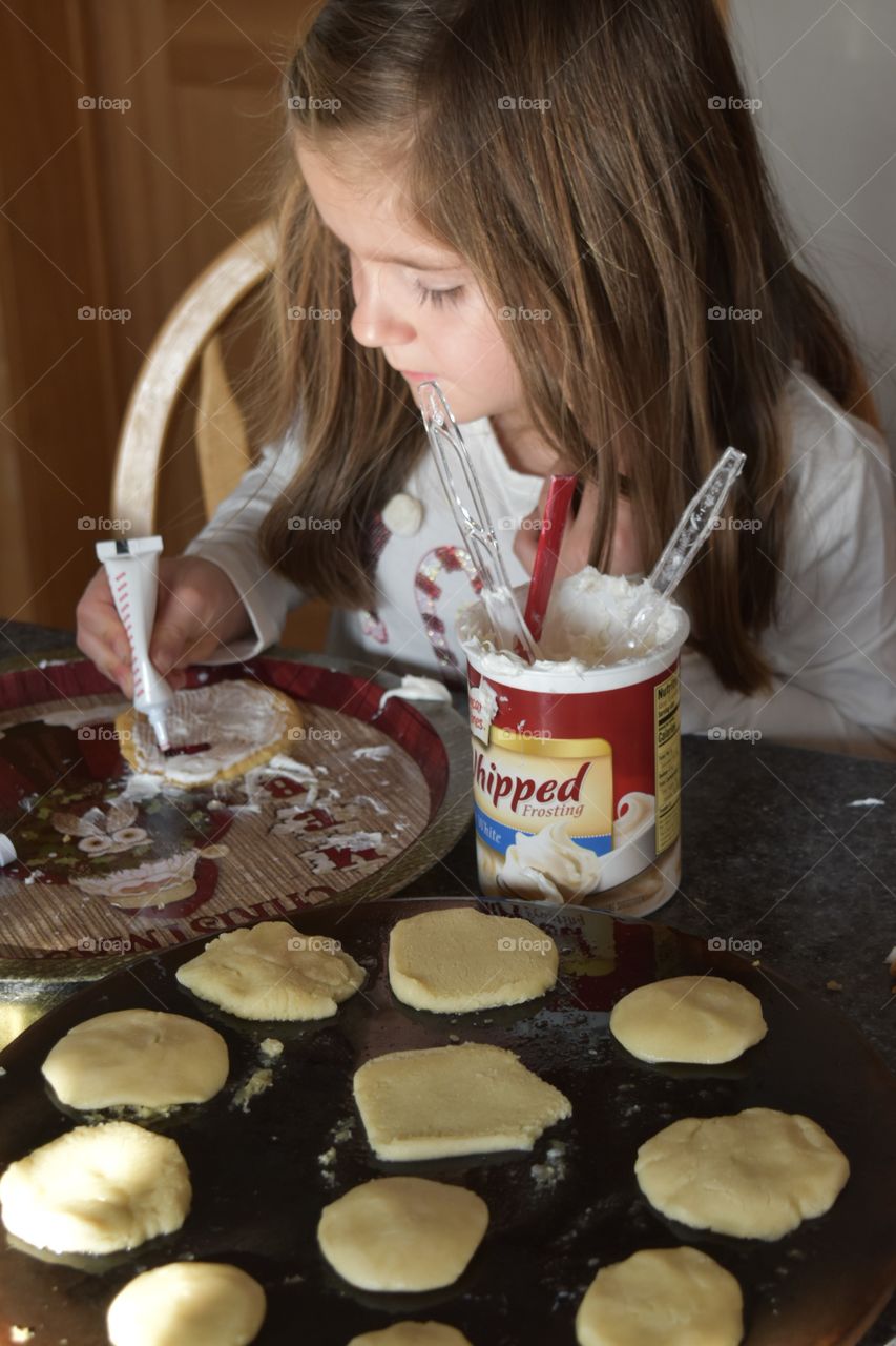 girl decorating cookies