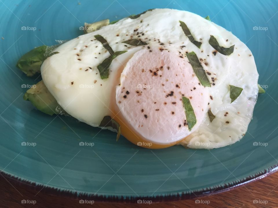 Egg with avocado and basil