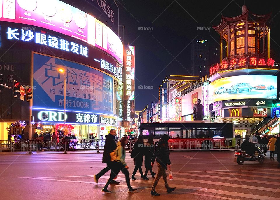 Night time street scene in Changsha, Hunan Province, China.