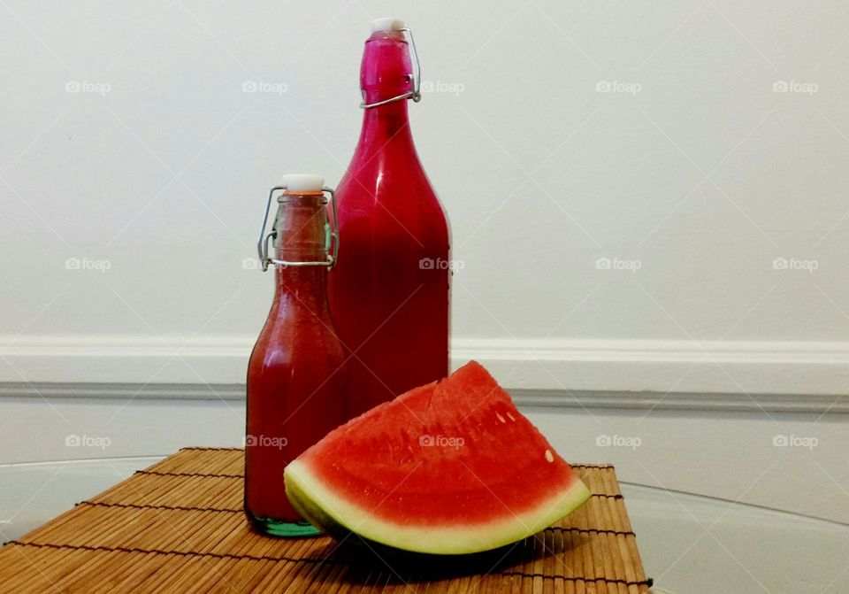 Slice of Watermelon with Watermelon Juice in bottles