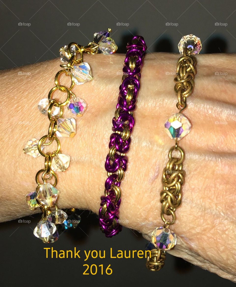 Hand made womens bracelets. Three different designs, all are different  styles. Model is wearing 3 bracelets together.