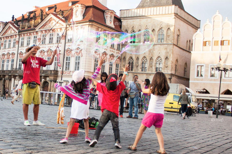 Kids chasing bubbles 