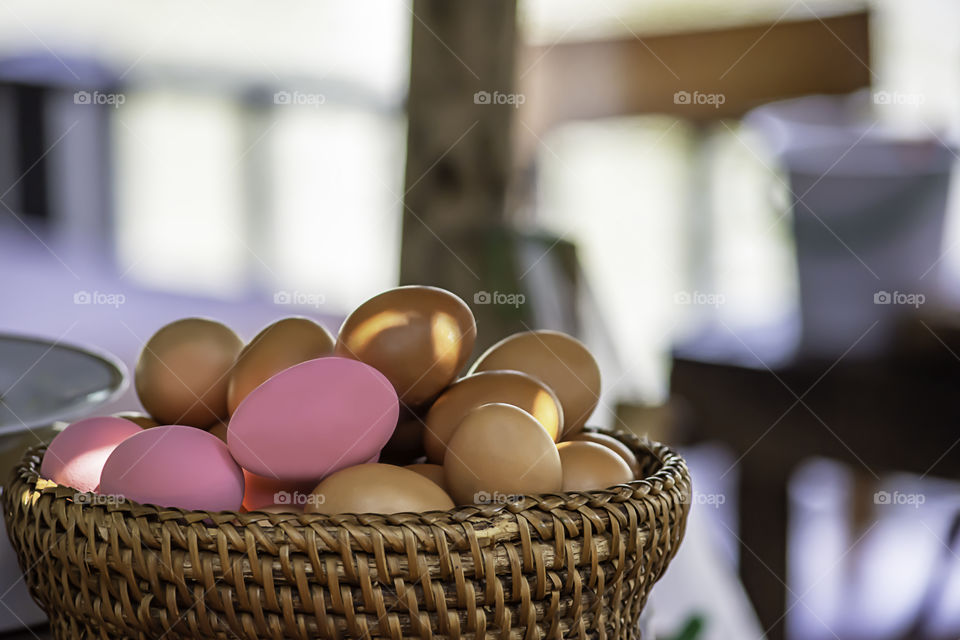 Egg and preserved egg in a wicker basket